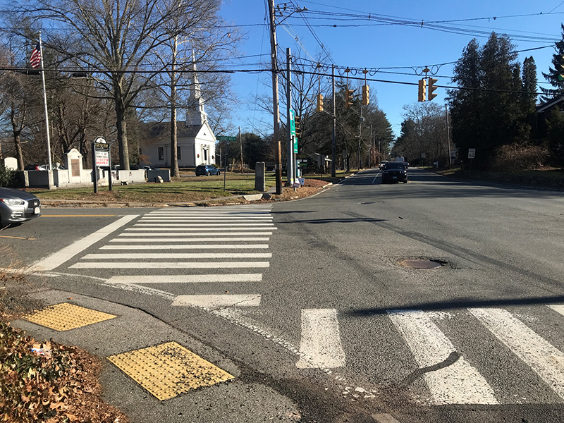 Figure 3 - View across Library Hill Road of Northeast Intersection Corner. Image of crosswalk and the First Parish Church of Stow & Acton. Figure 3 - View across Library Hill Road of Northeast Intersection Corner. Image of crosswalk and the First Parish Church of Stow & Acton.